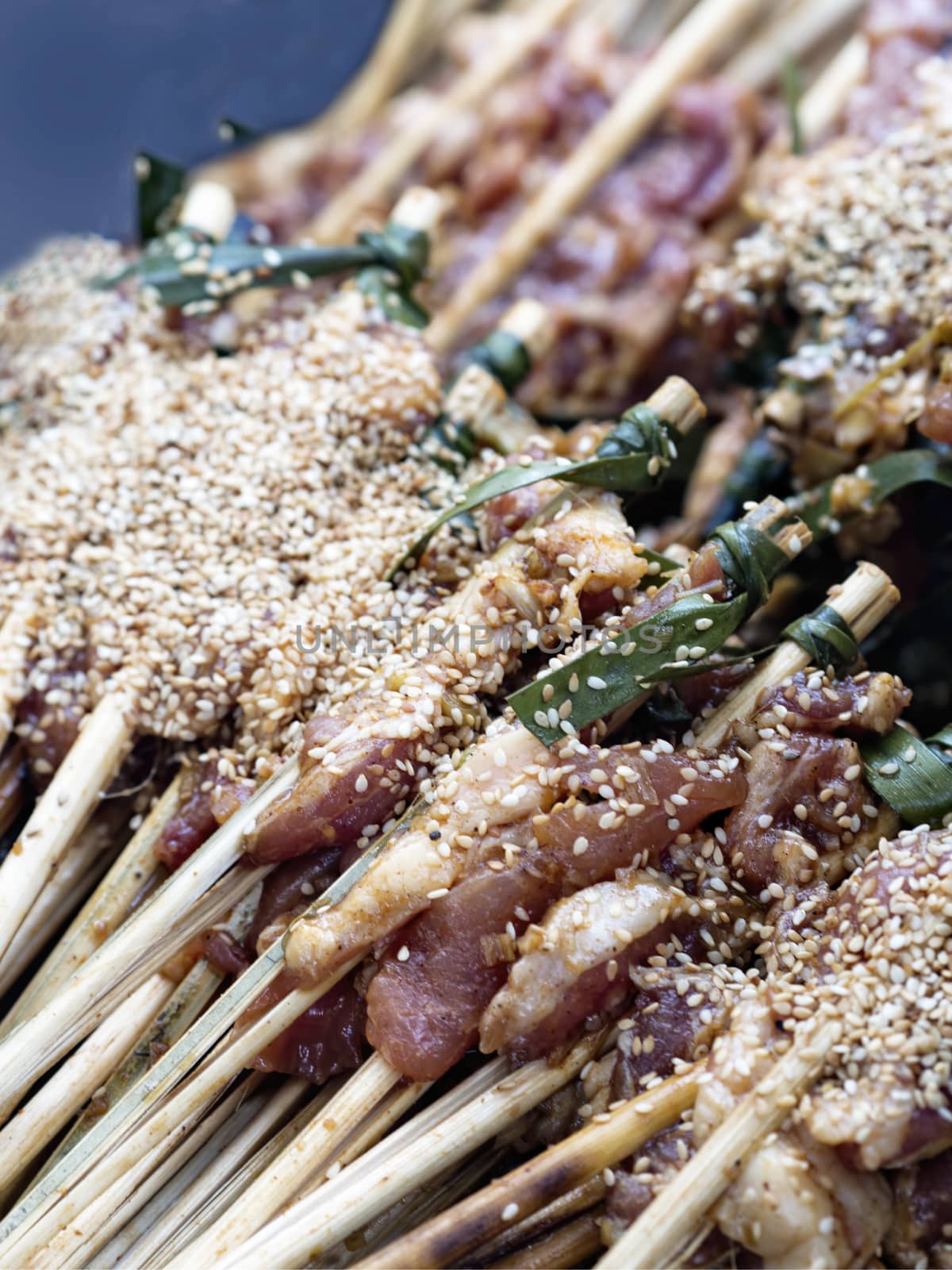close up of uncooked pork skewers in hoi an vietnam