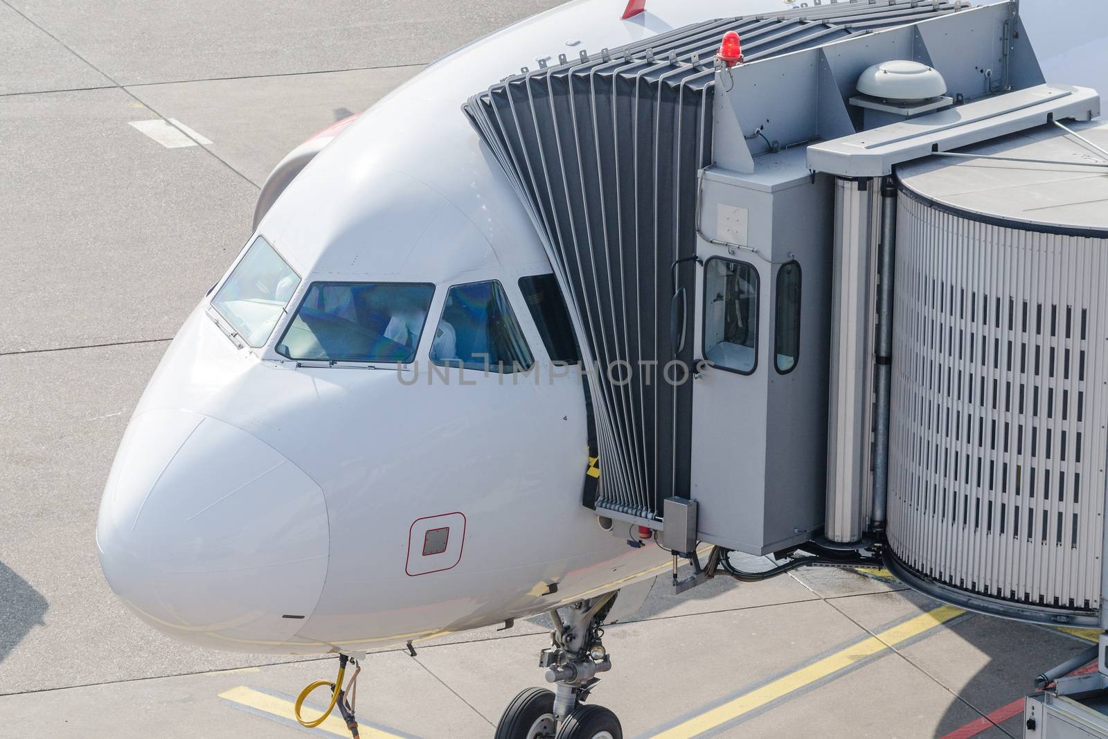 Airplane bridge, footpath in the airport for passengers entering or leaving the plane.