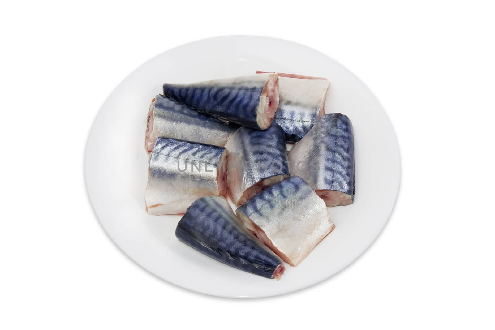 Sliced pickled atlantic mackerel on a white dish on a light background
