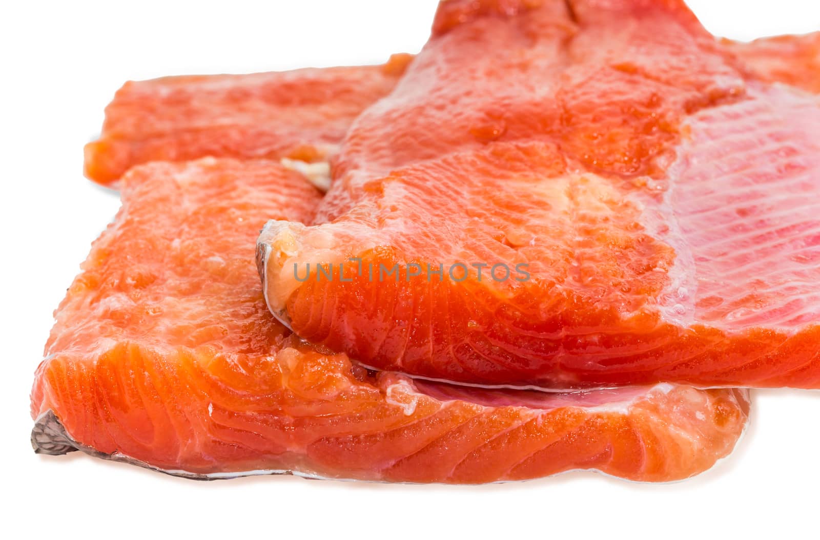 Several pieces of fresh uncooked fillet of rainbow trout closeup
