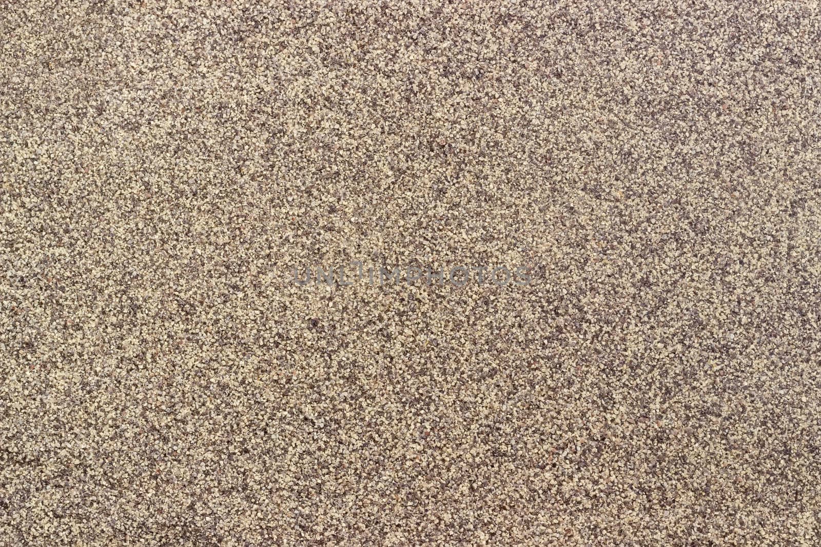 Background of ground black pepper milled coarsely closeup
