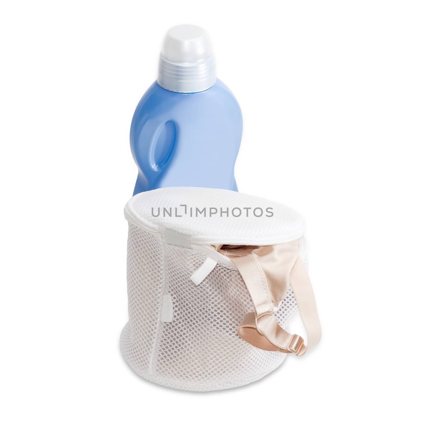 Special laundry bag for washing bras in washing machine against the background blue plastic bottle of a detergent on a light background
