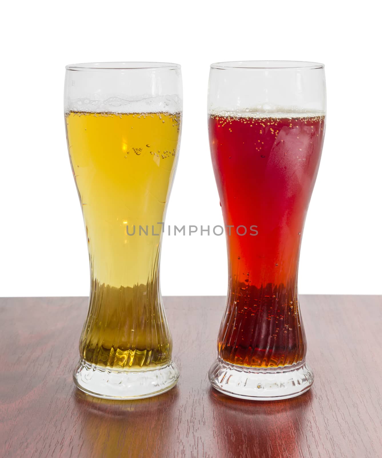 Two beer glasses with lager beer and dark beer on a wooden table on a light background
