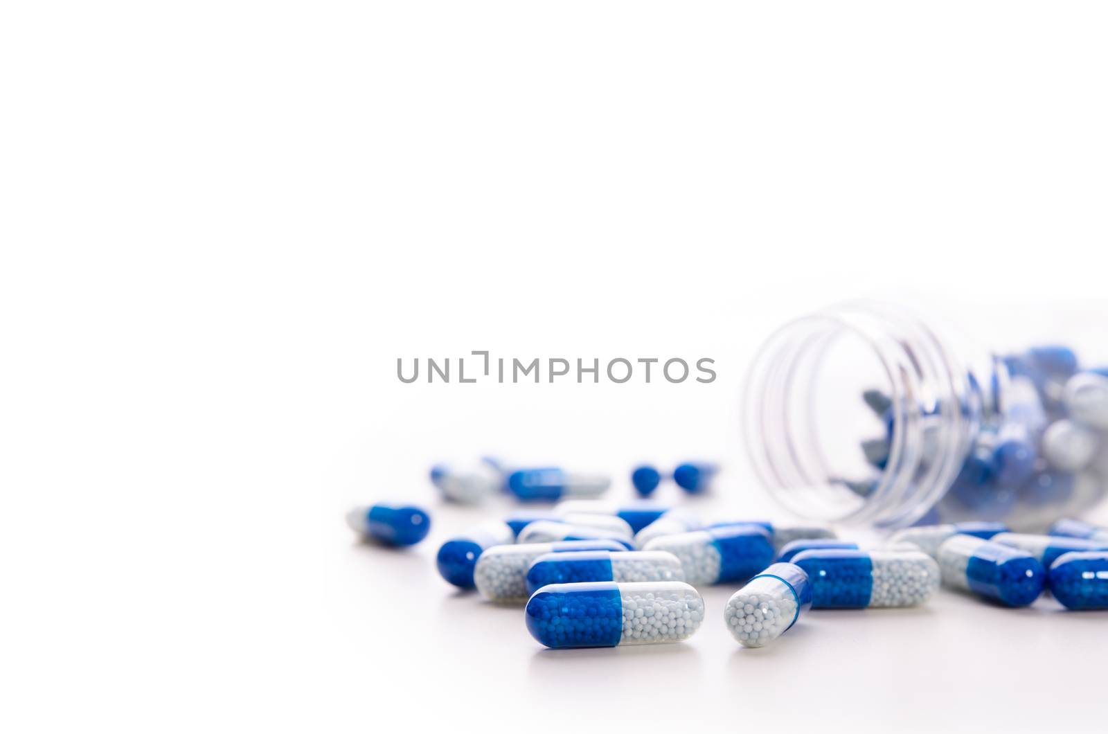 Pile of scattered capsules on a white background. capsules isolated white capsule pharmacy bottle pill drug concept