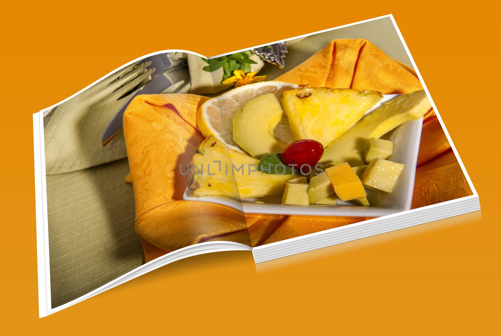 book pineapple and ripe avocatebook, on a green place mat