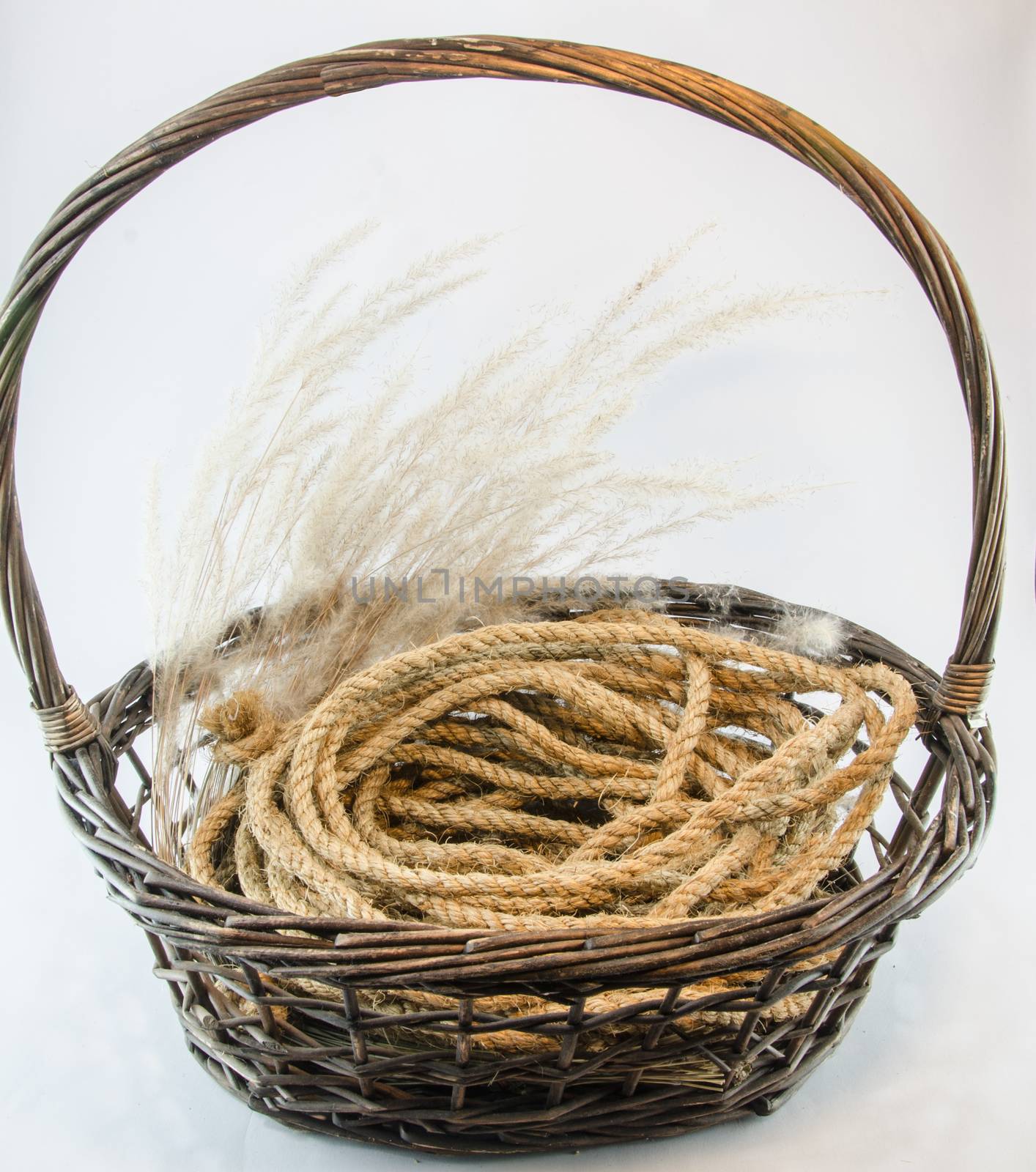 Hemp rope wicker brown basket isolated on white