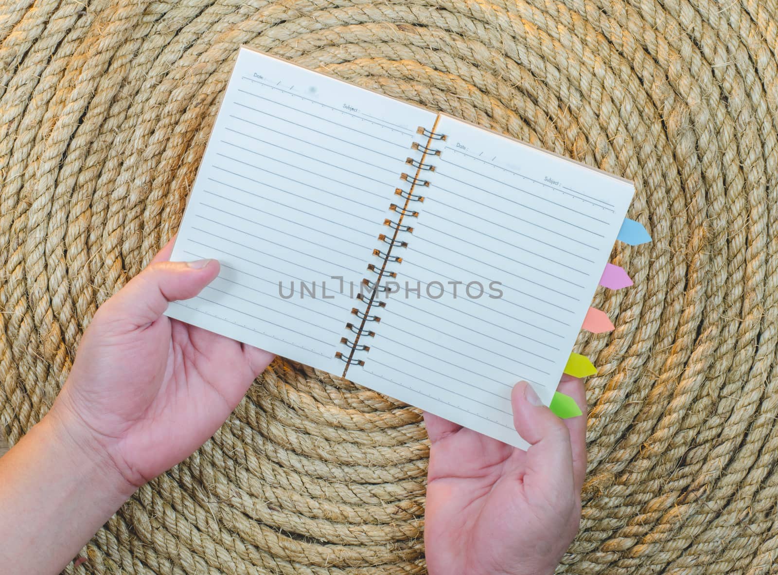 Open Hand Book on a jute rope background