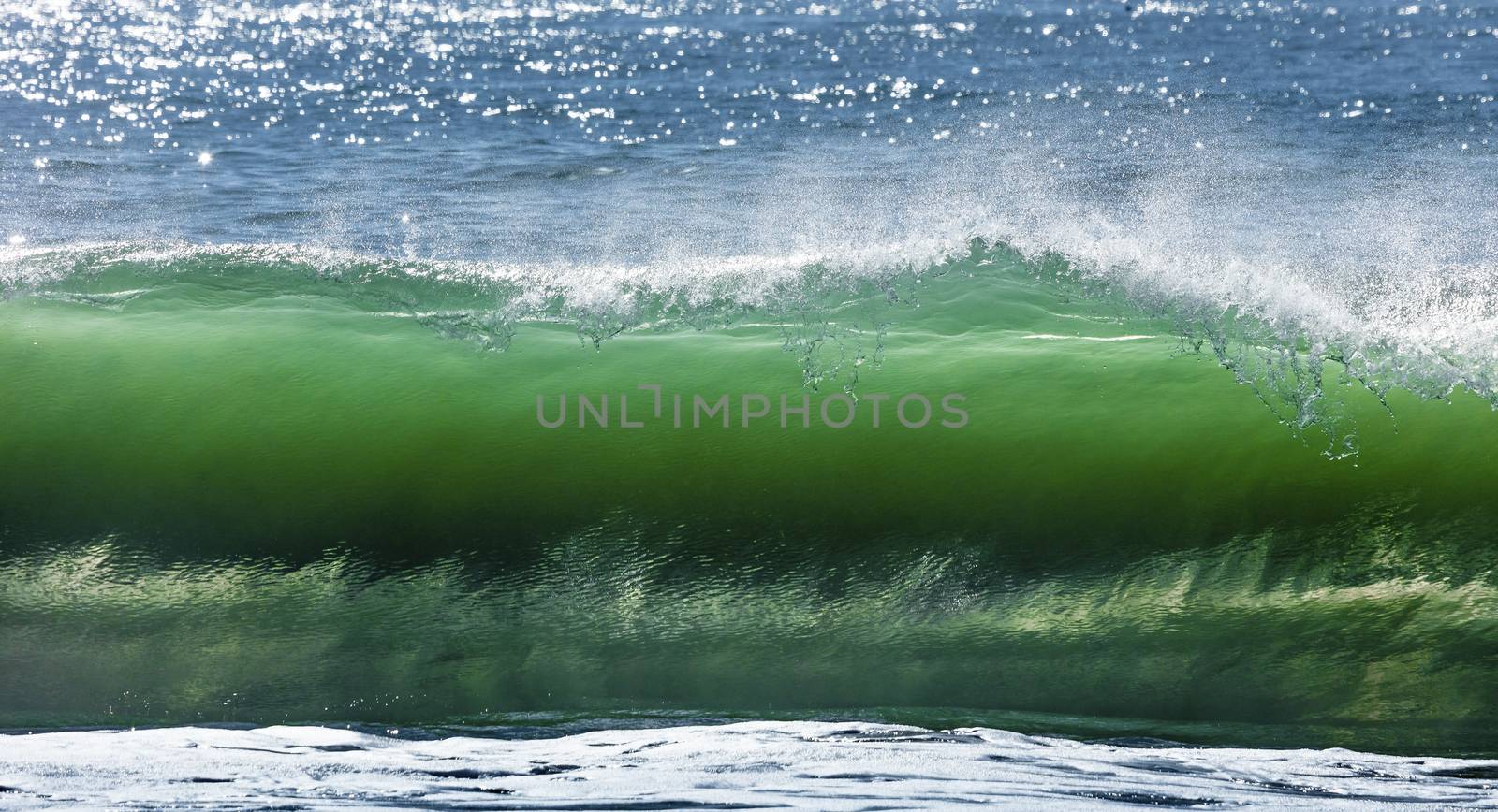 Big wave break spray in the Pacific Ocean by hanusst