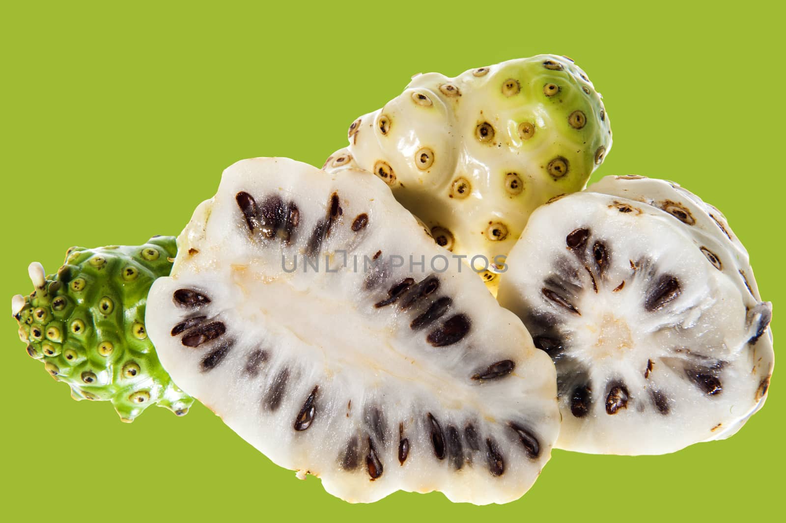 some Morinda citrifolia on a white background