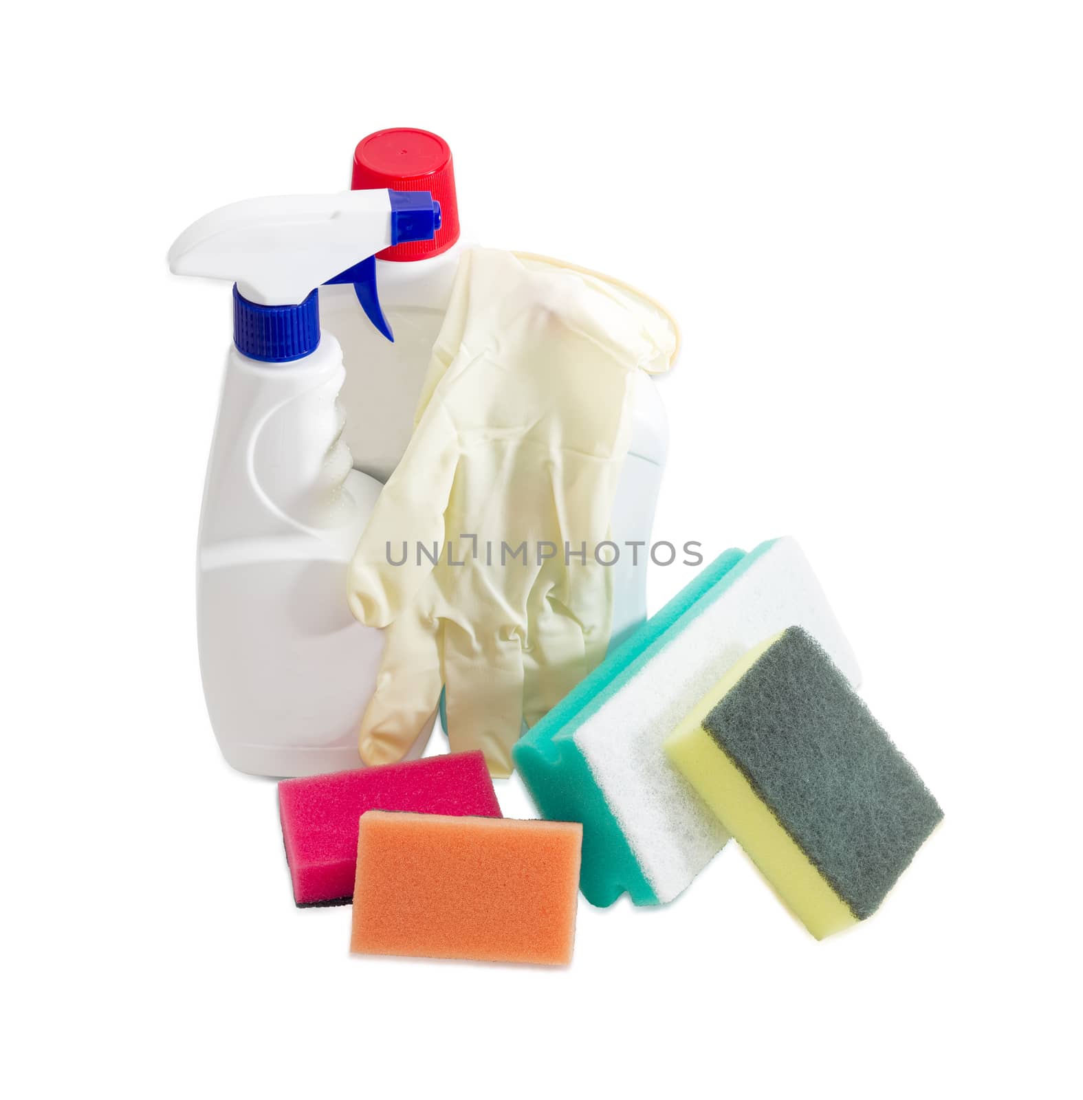 Several synthetic cleaning sponges with layer for more intense scrubbing different colors and sizes, plastic bottles of cleaning agent and spray bottle, household rubber gloves on a light background
