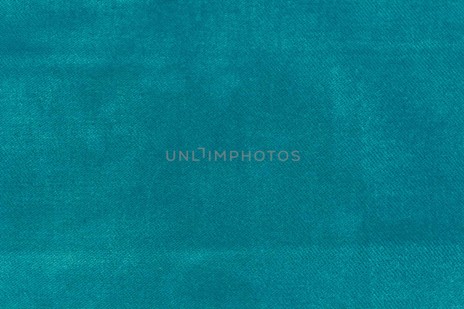 The Velvet fabric texture in turquoise color.