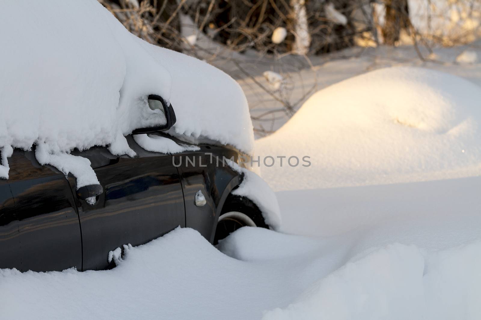 Snow covered car from a heavy winter