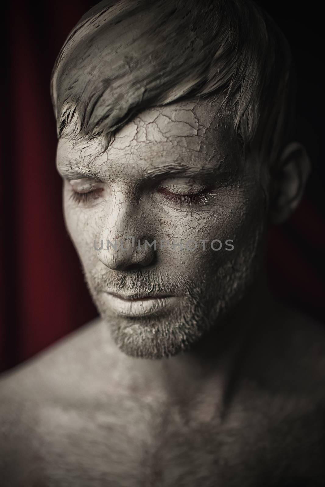 Man Face with Skin Covered in Mud by Multipedia