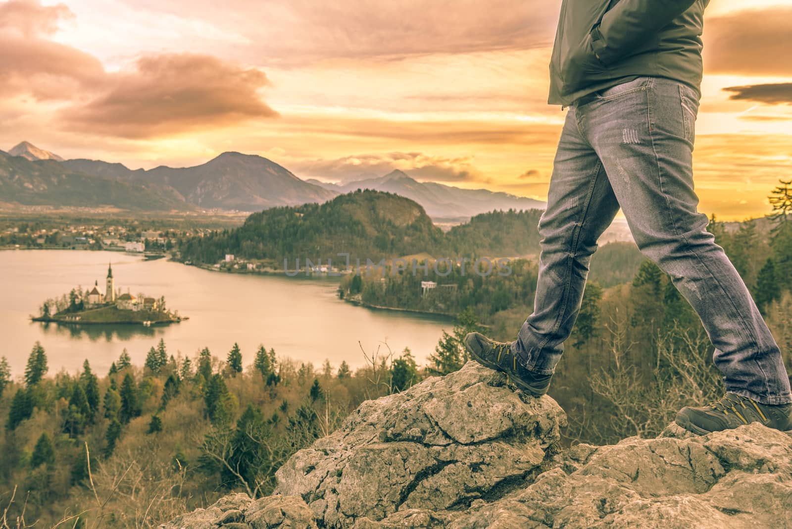 Hiker legs and view over Lake Bled by YesPhotographers