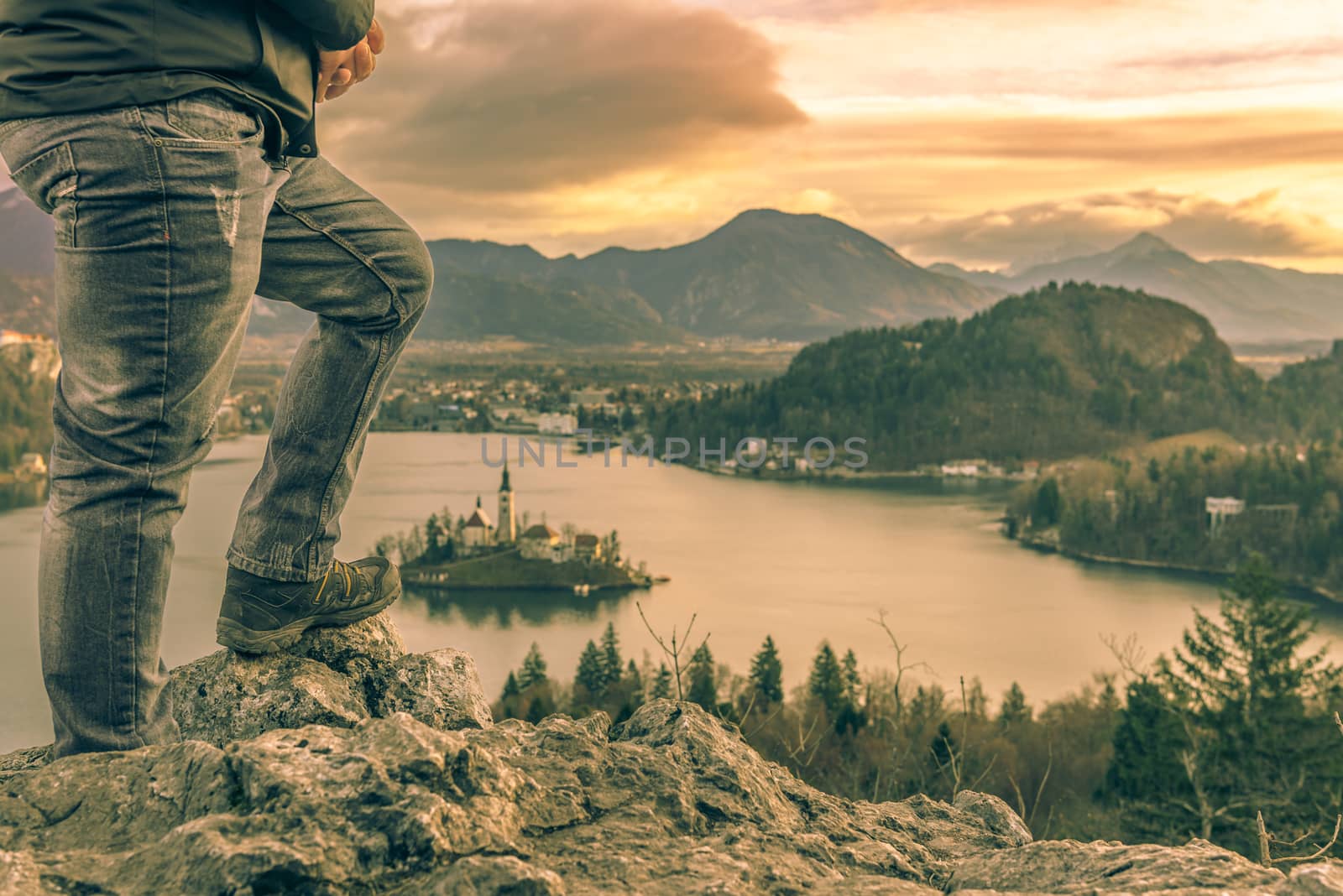 Man climbed on rocks at sunrise by YesPhotographers