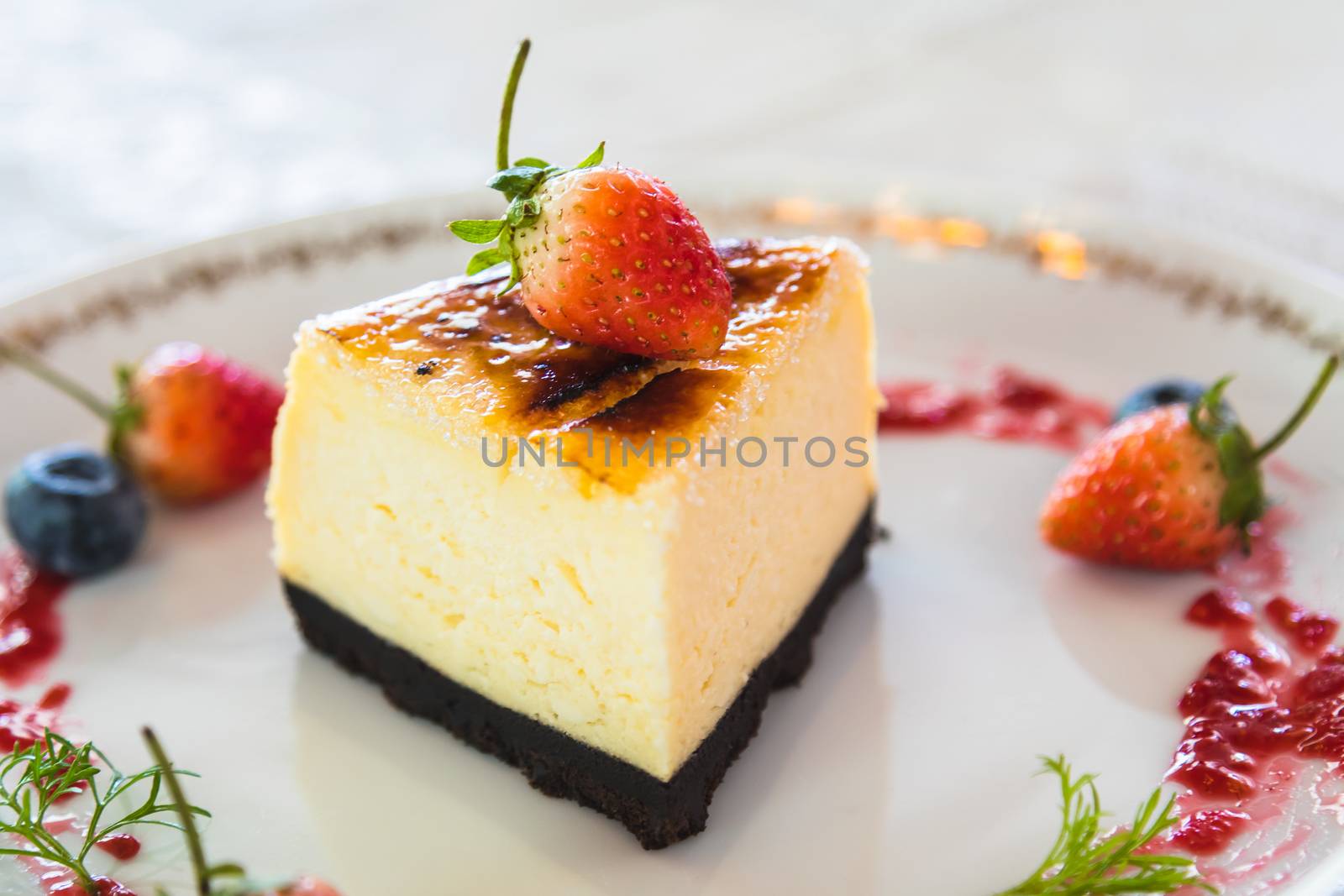 cheesecake with fresh strawberry and blueberry decoration