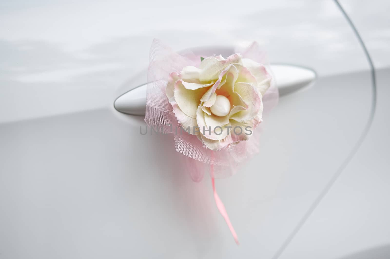 flower decoration on the handle of a wedding car.