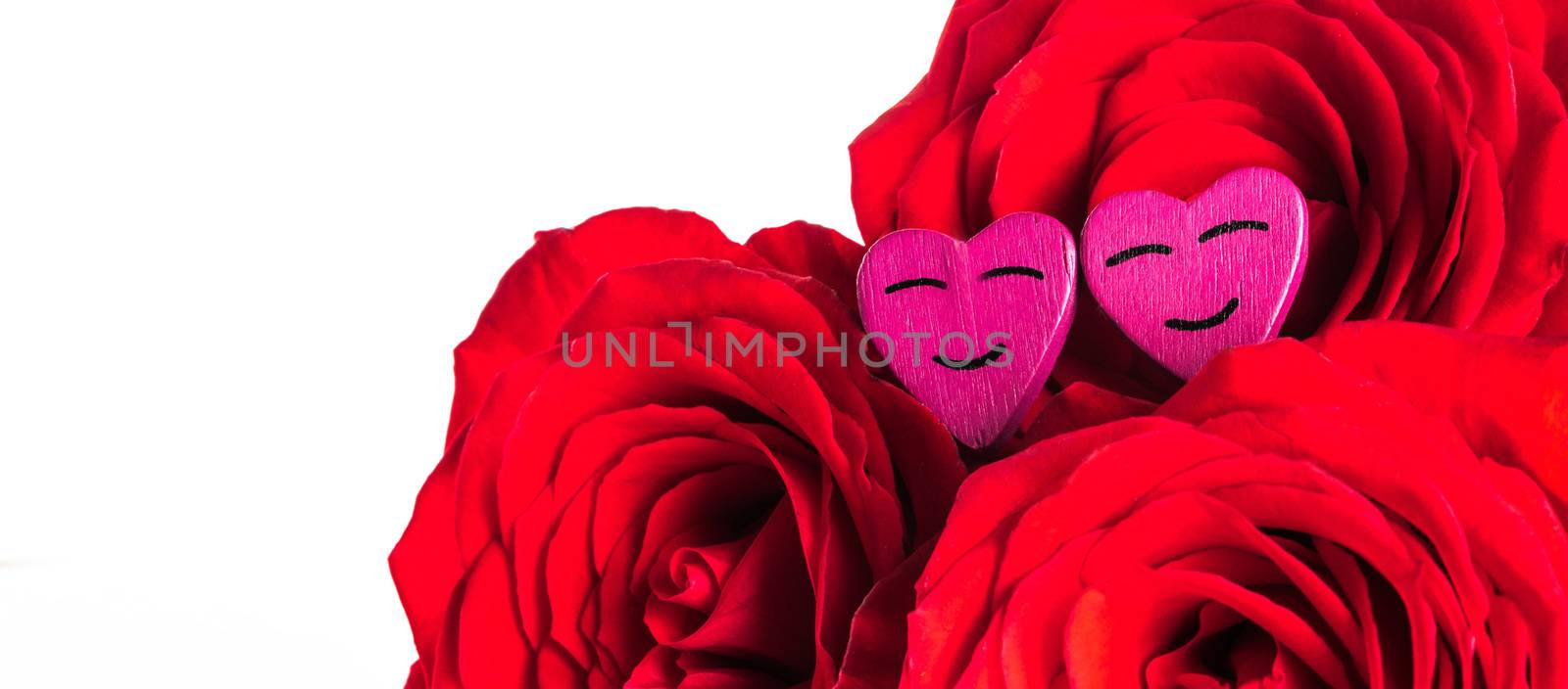 Roses and small smiling hearts isolated on white background
