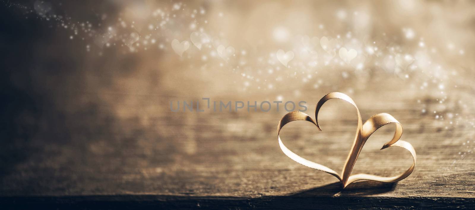 Two ribbon magic hearts on wooden backround, Valentine day concept