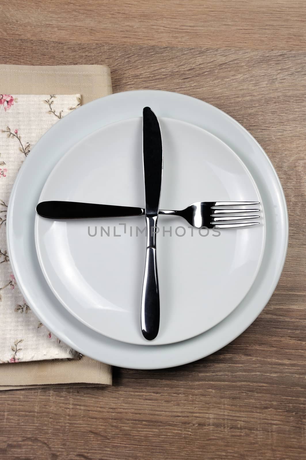 Dining etiquette - I still eat, ready for second plate. Fork and knife signals with location of cutlery set