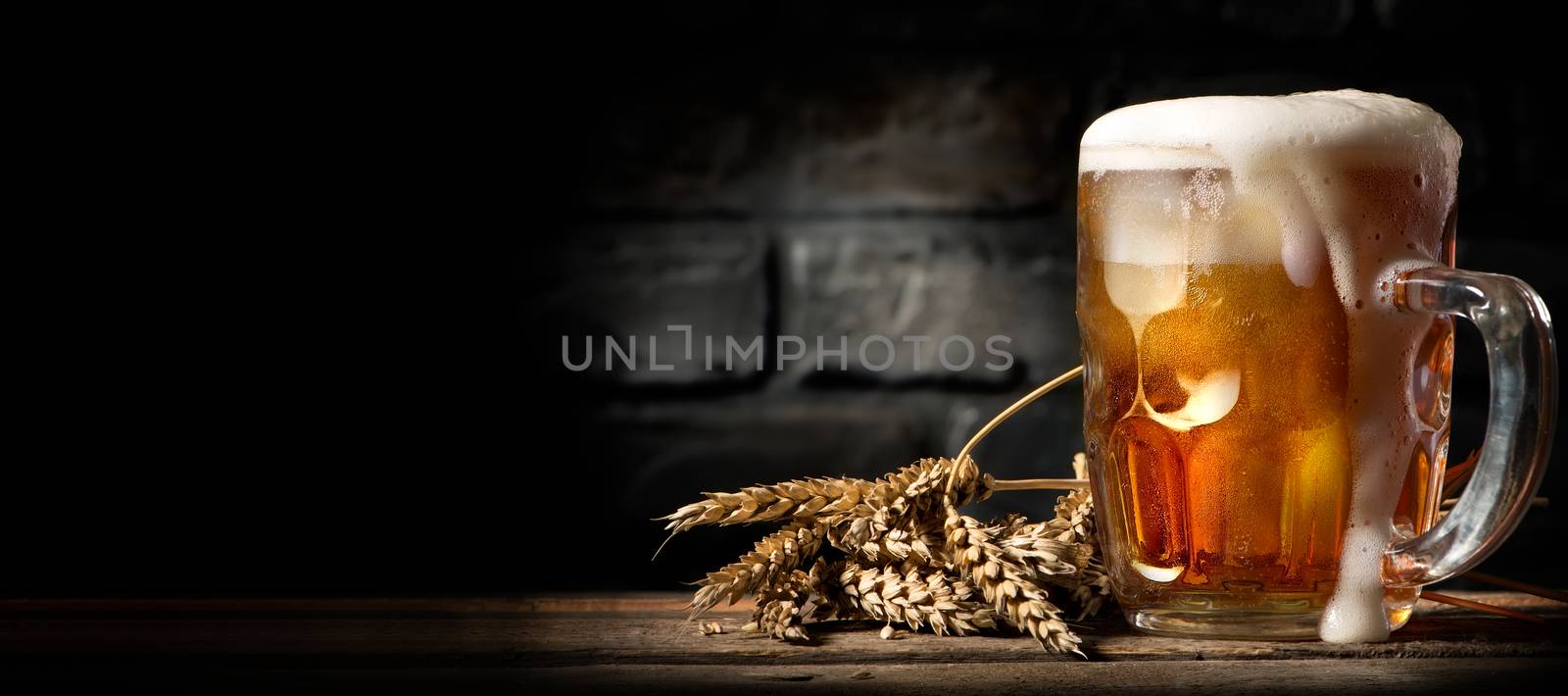 Beer in mug on table by Givaga