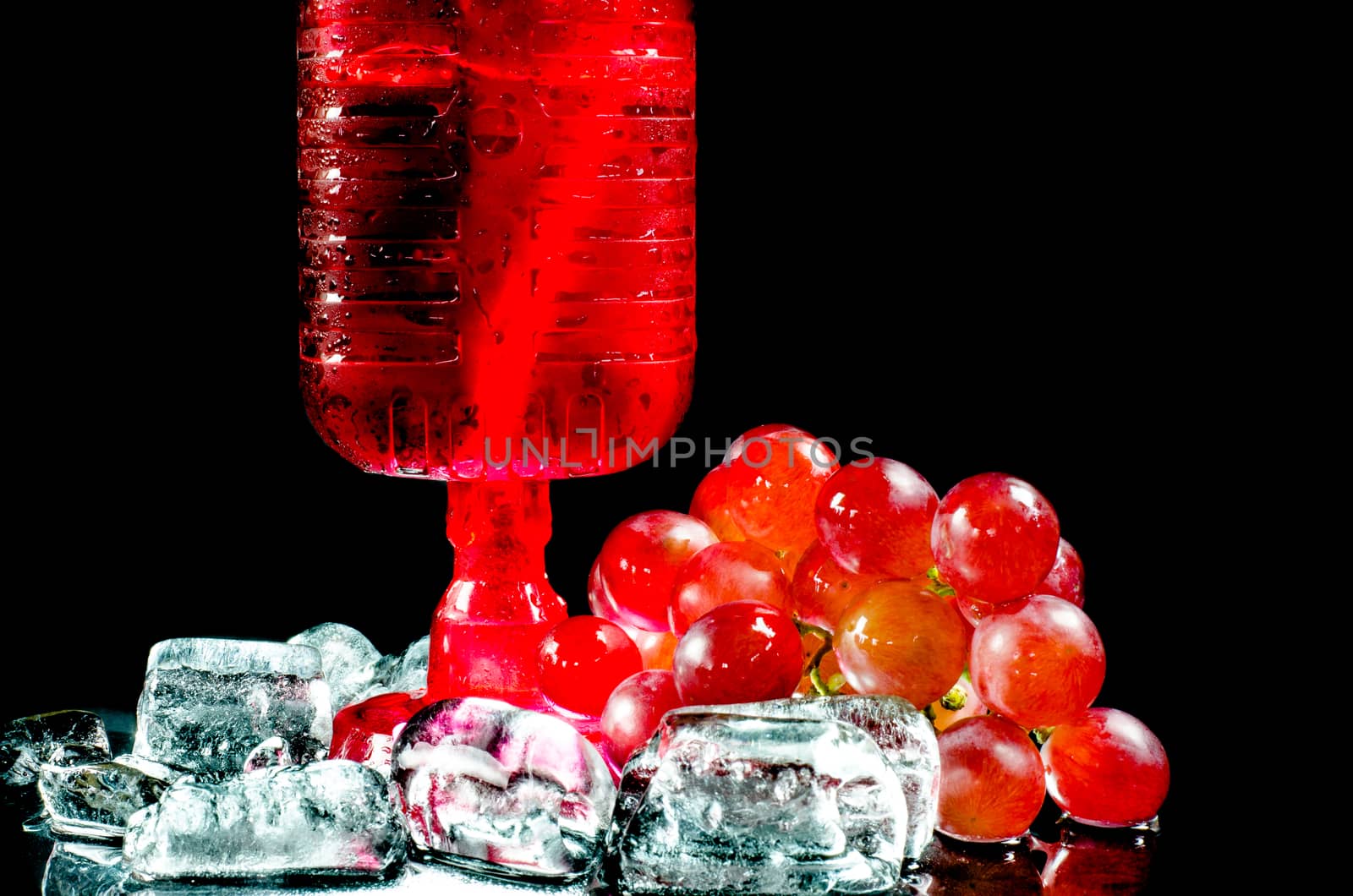 Glasses  red wine and  grape closeup a black background. by metal22