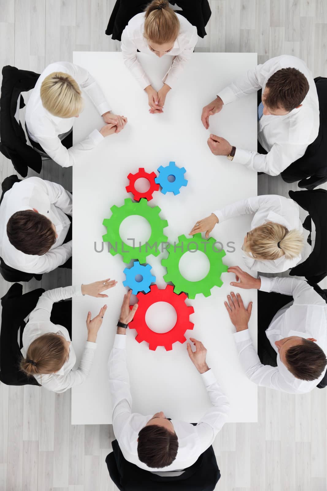 Business team with cogs by ALotOfPeople