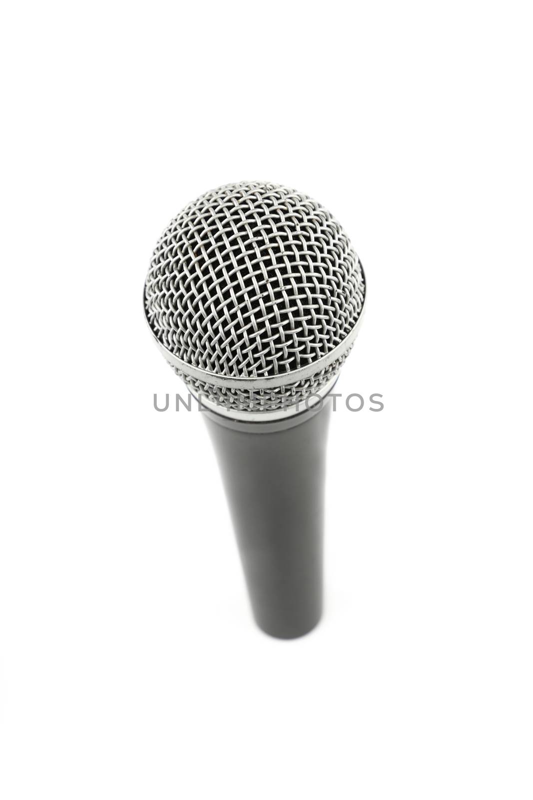Vocal microphone high angle view close up isolated on white background, personal perspective