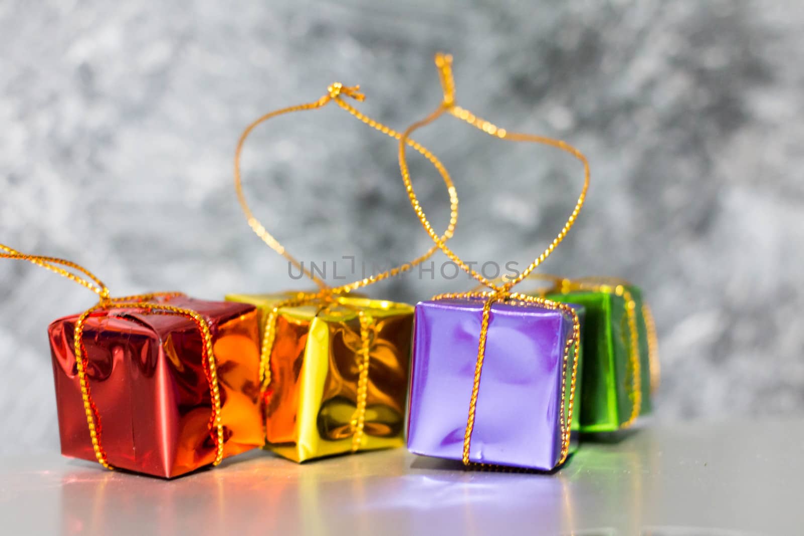 Gift Box And Baubles On Snow With Shiny Background