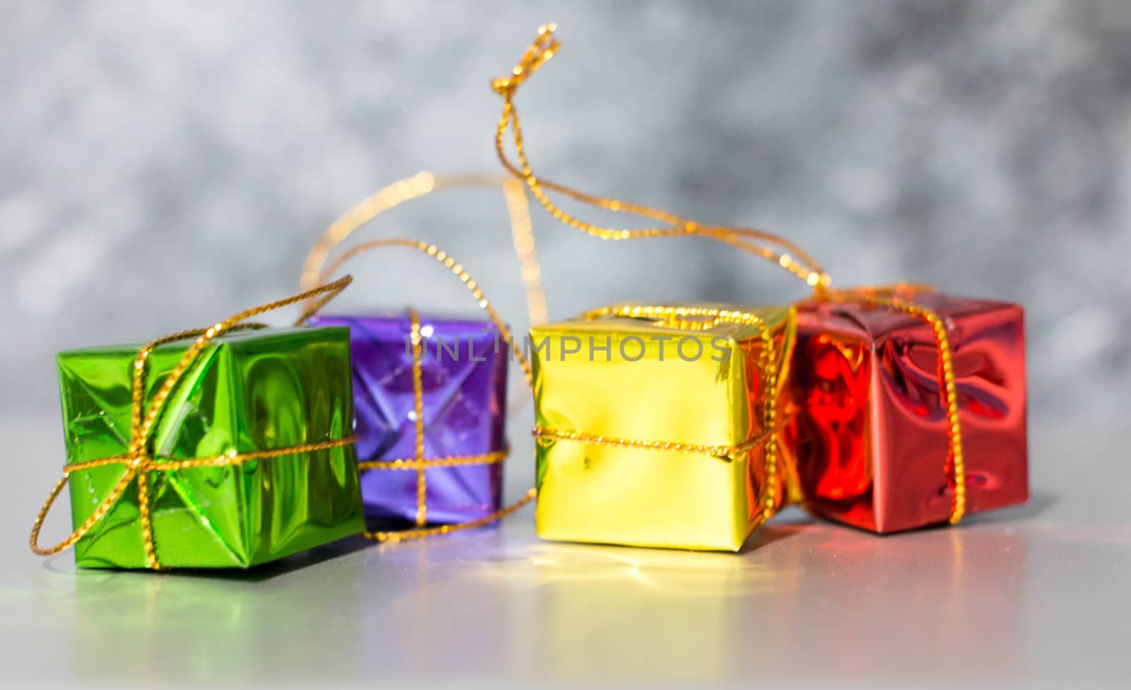 Gift Box And Baubles On Snow With Shiny Background