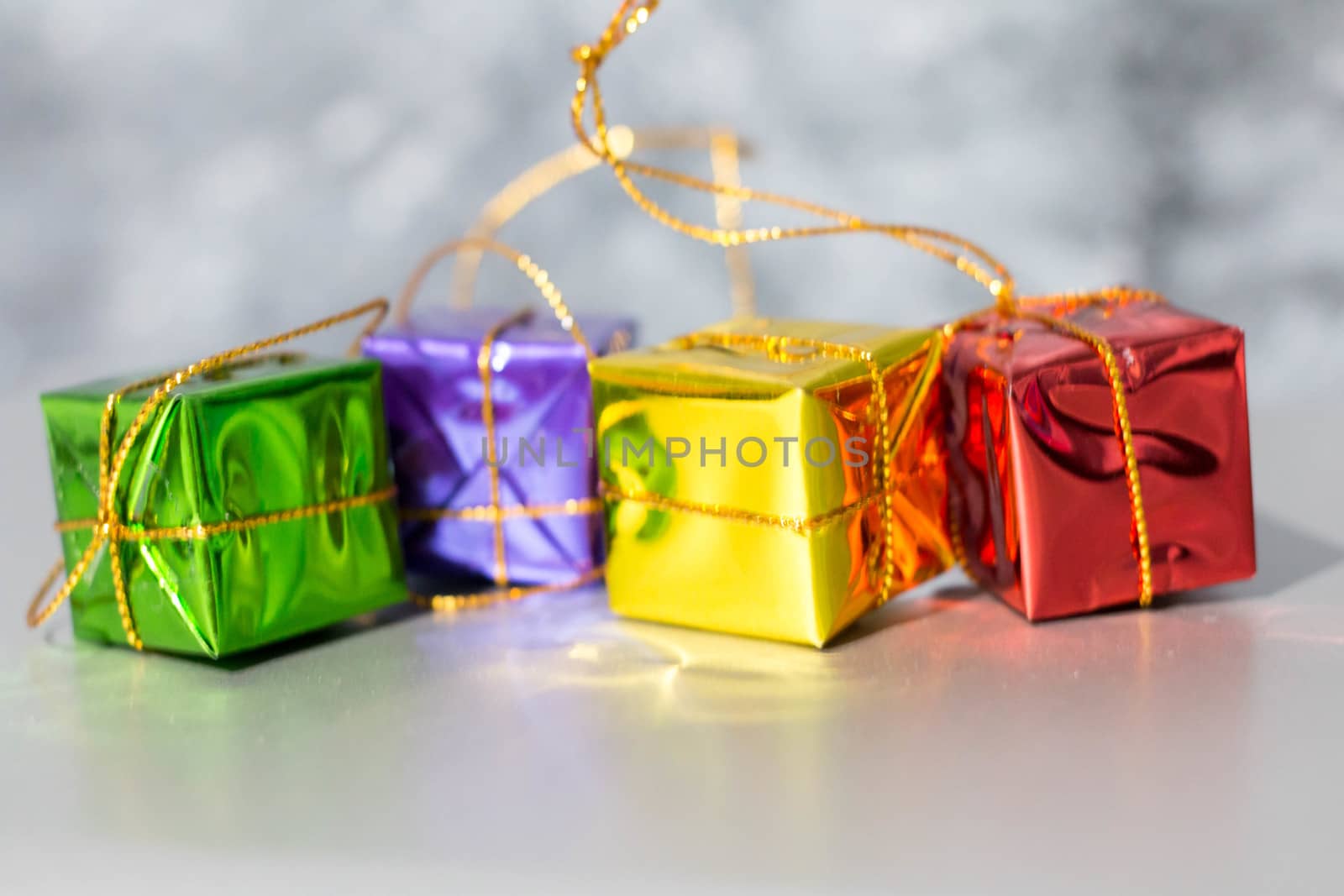 Gift Box And Baubles On Snow With Shiny Background