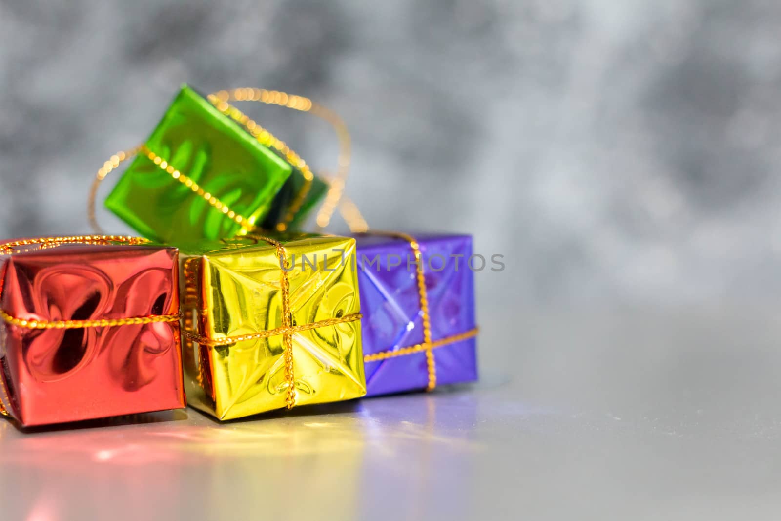 Gift Box And Baubles On Snow With Shiny Background