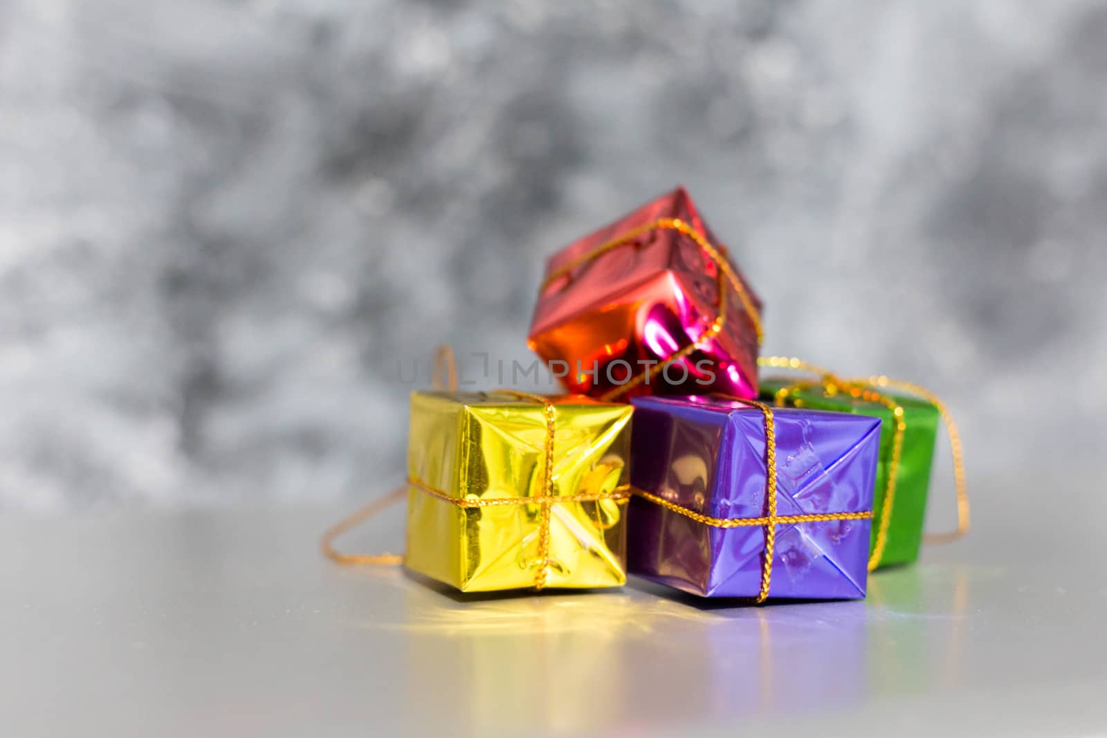 Gift Box And Baubles On Snow With Shiny Background