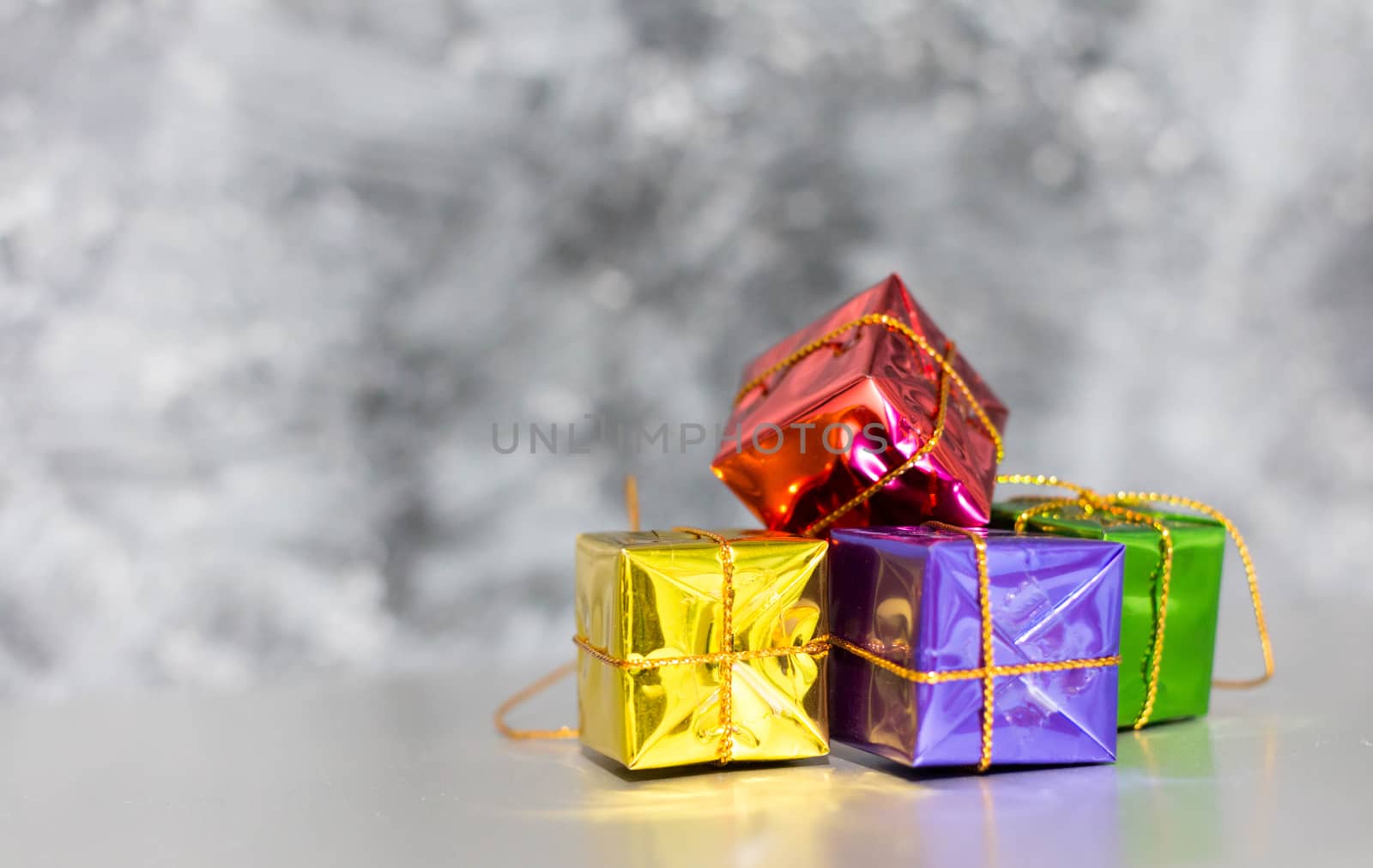 Gift Box And Baubles On Snow With Shiny Background