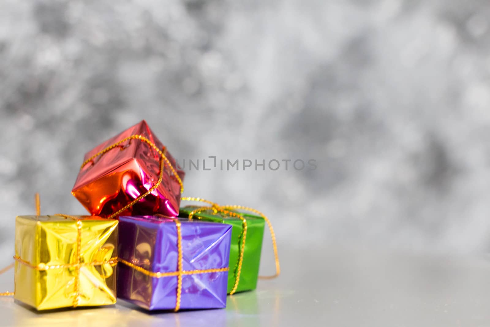 Gift Box And Baubles On Snow With Shiny Background