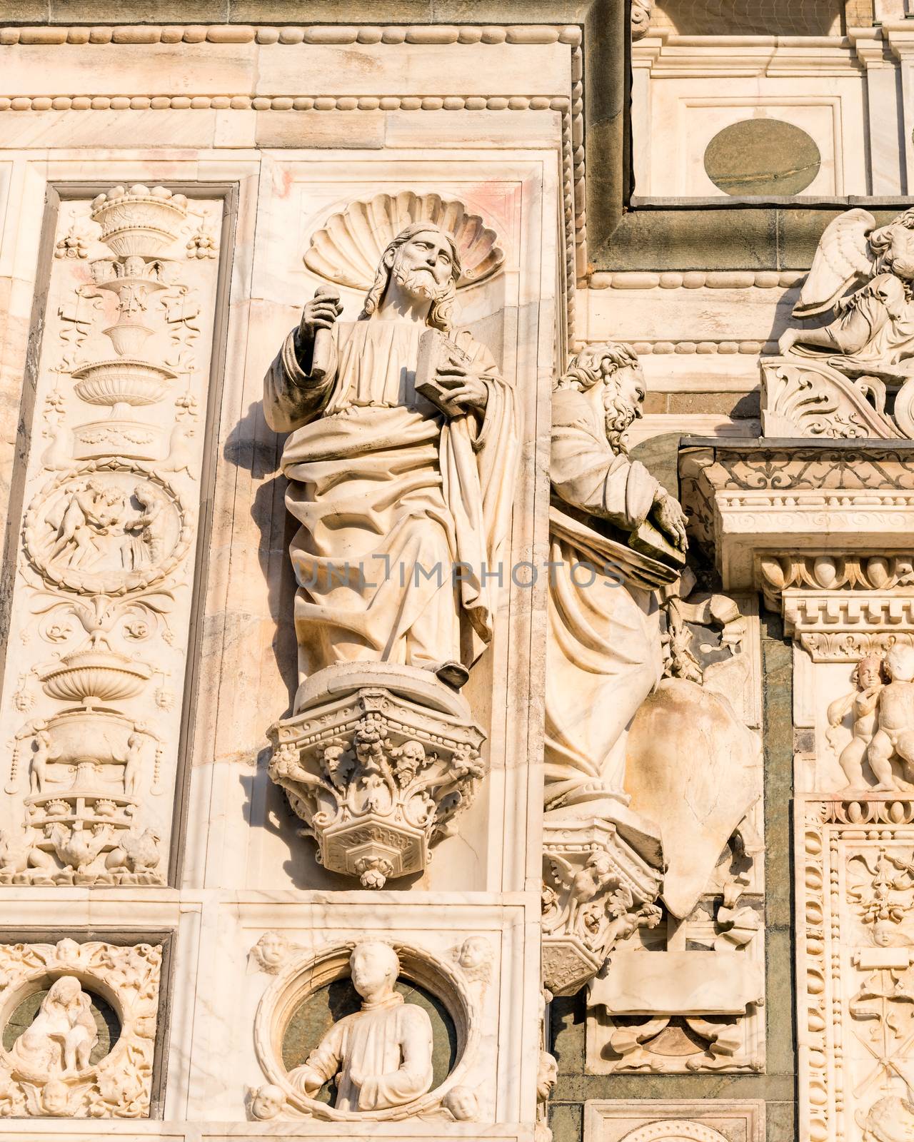 Beautiful marble statues from the Renaissance period of the Pavia Carthusian monastery at sunset,Italy.