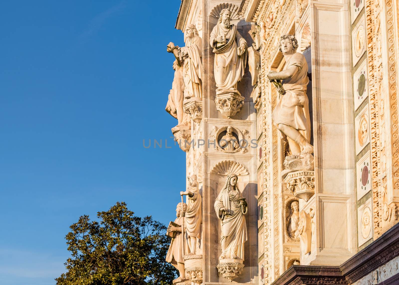 Beautiful marble statues from the Renaissance period of the Pavia Carthusian monastery at sunset,Italy.Copy space.