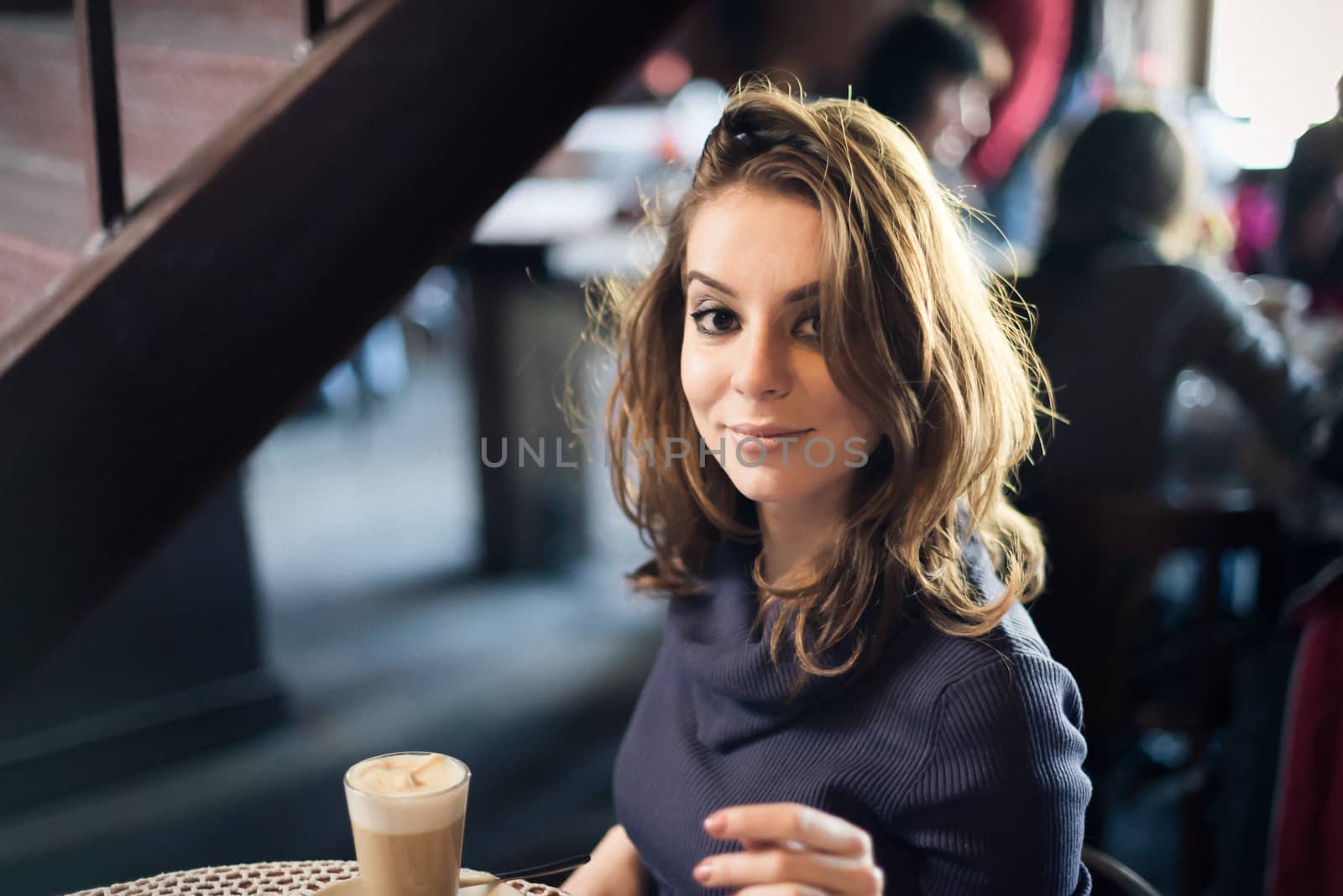 Portrait of beautiful girl in Cafe in the city