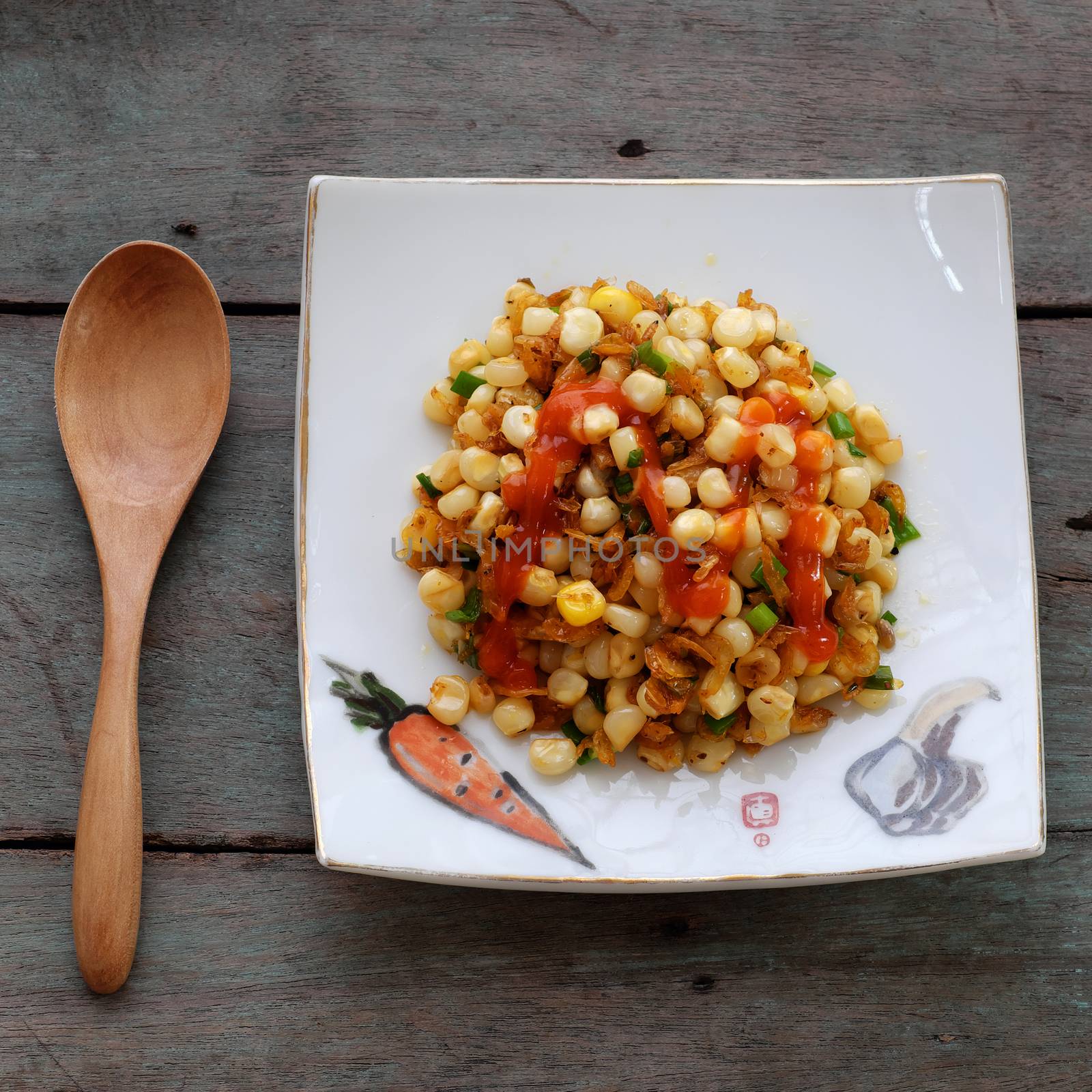 Vietnamese street food, corn fried dried shrimp, is popular snack food make from corn fry with shrimp, butter, scallions, eat with chilli sauce 