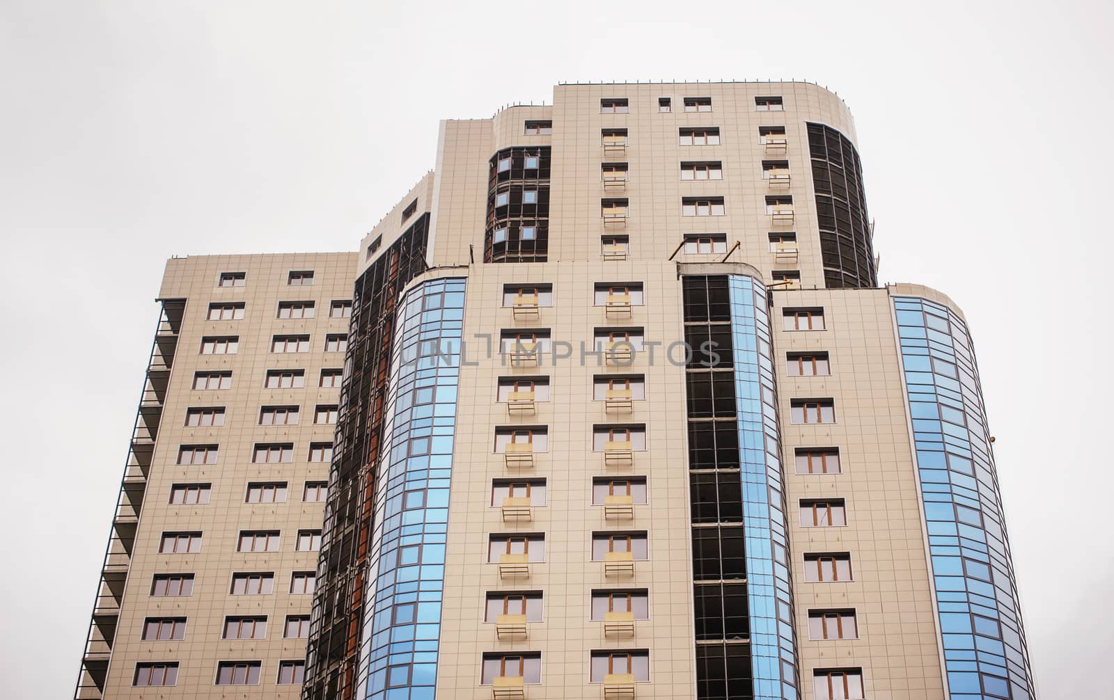 Multistorey apartment house on a white background.