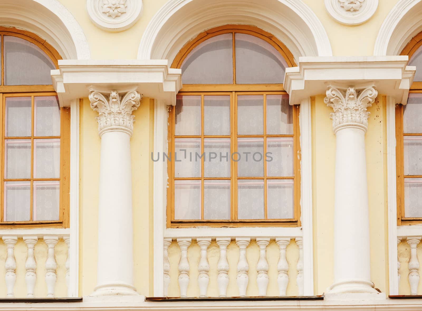 architecture of the historic building with Windows arches and columns.