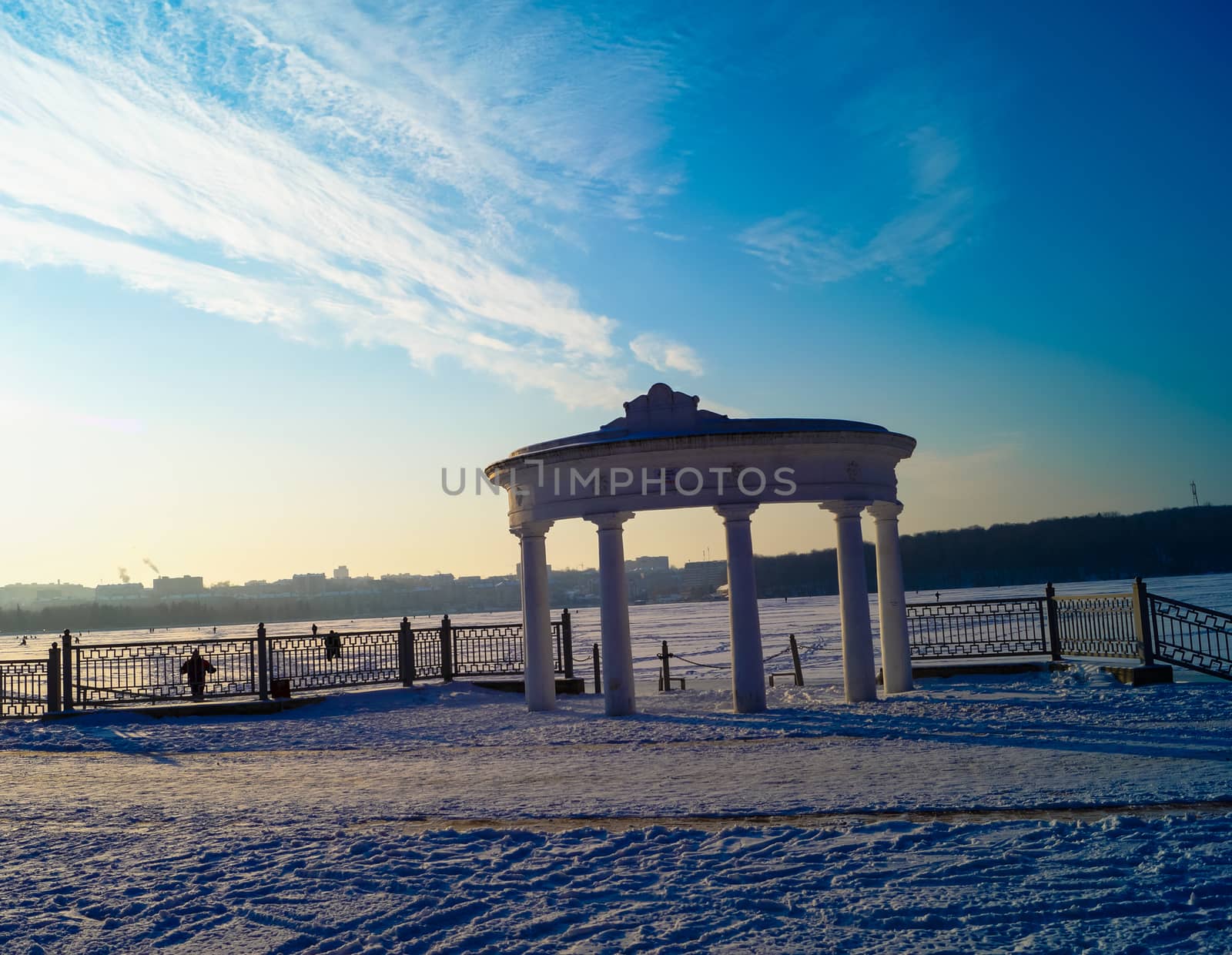 architecture arch against the sky on the lake in winter