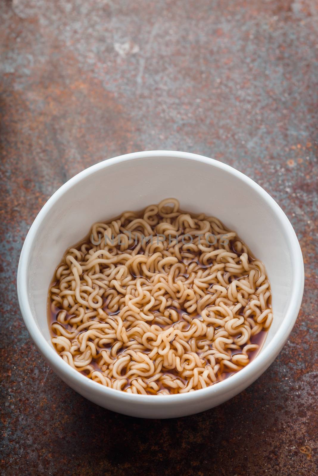Soup Ramen noodles in ceramic bowl on the metal background by Deniskarpenkov