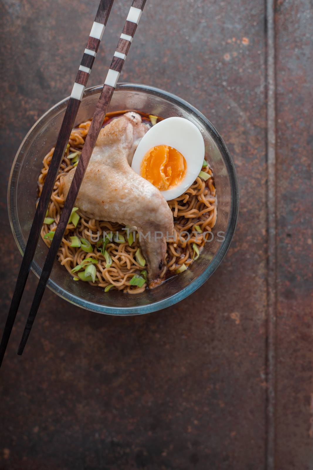 Soup Ramen noodle with chicken wing and green onions vertical