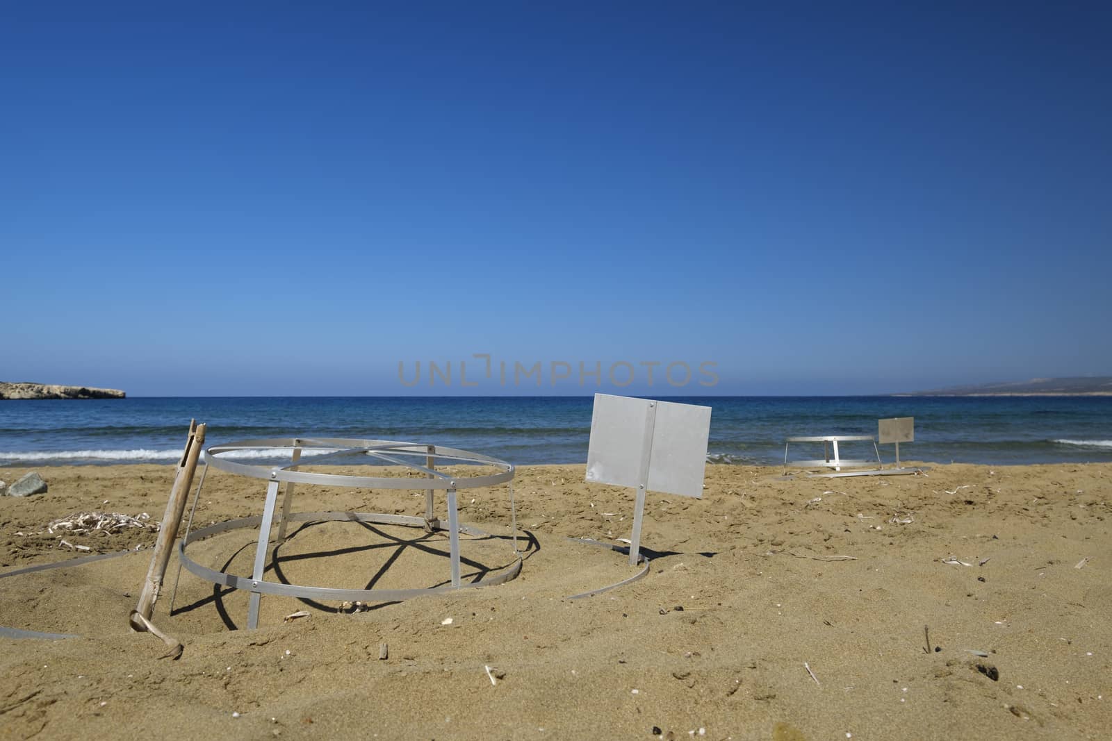 with iron racks protected sea turtles nests on the beach in Cyprus
