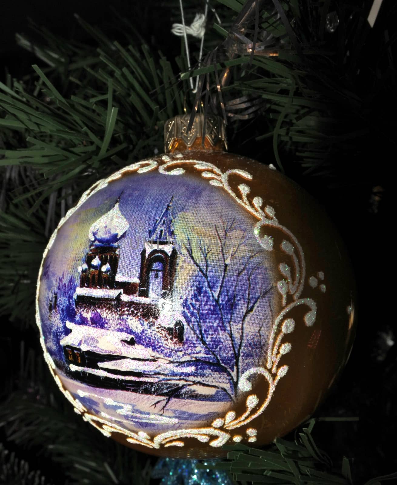 New Year and Christmas theme. Hand made Christmas balls on Xmas Tree. Christmas ball with winter Church picture.