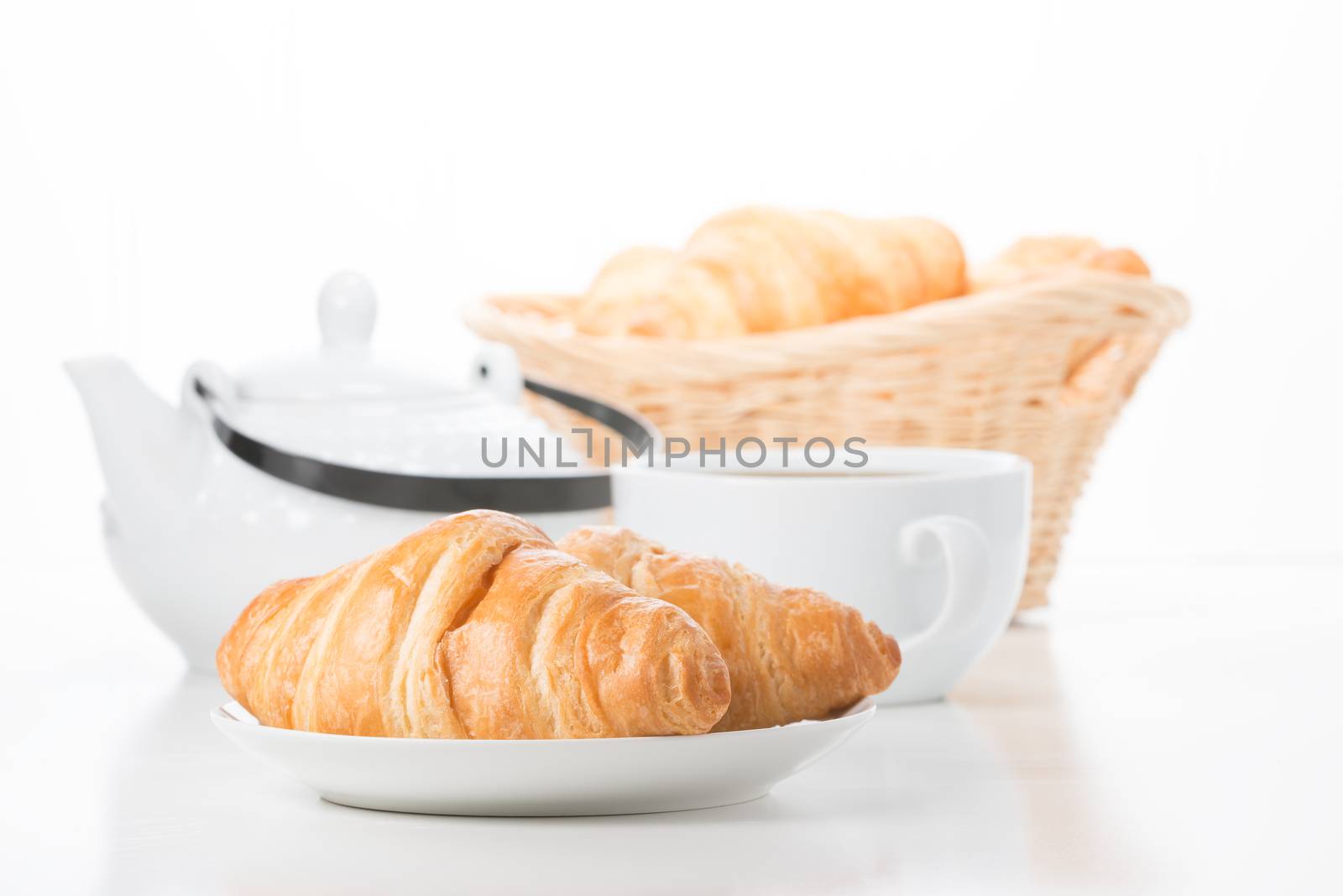 Fresh buttery croissants served with coffee at breakfast.