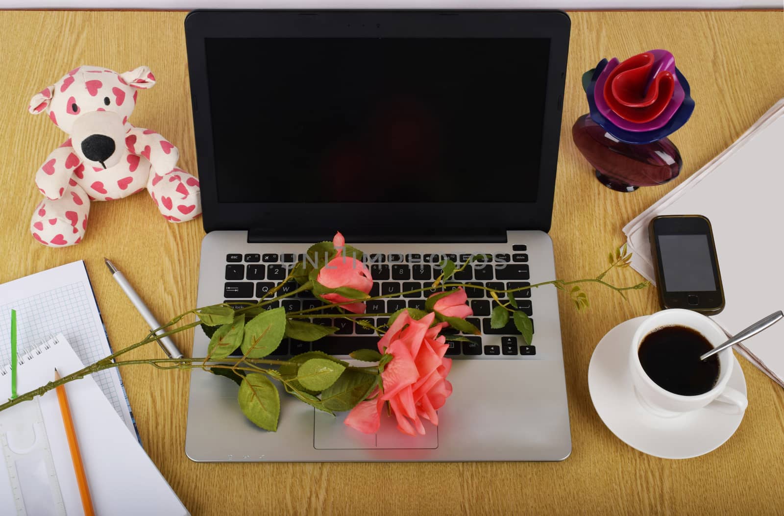 Mock up objects such as computer, smartphone on a wooden background, front view