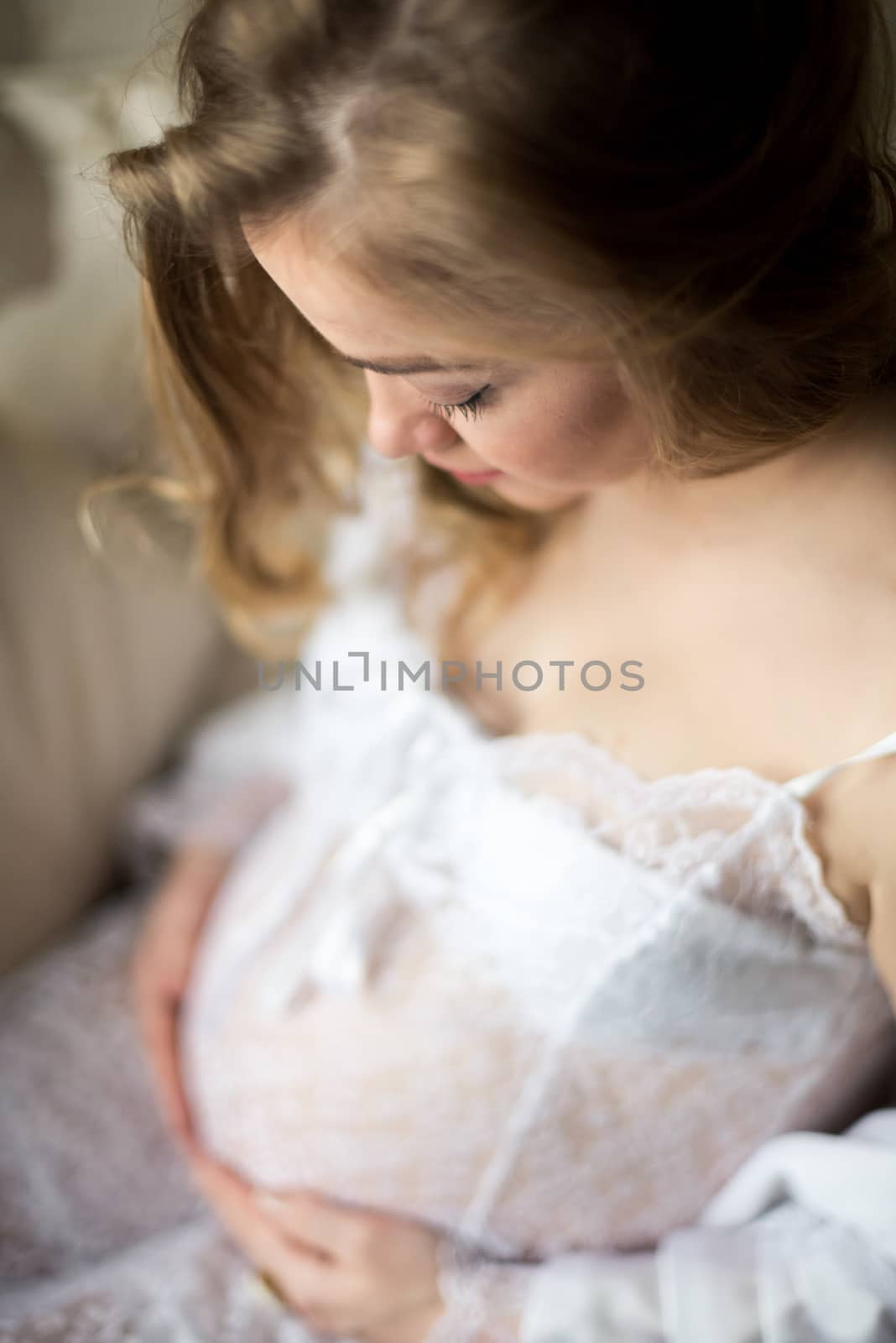 Portrait of a pregnant woman in the room