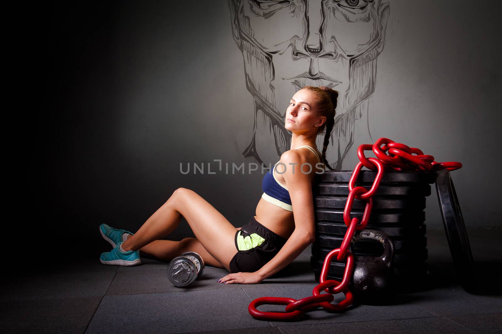 one young attractive woman with sports equipment chain